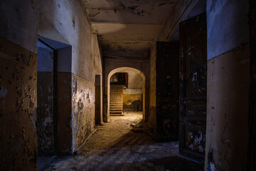 Dark creepy vaulted corridor in old abandoned building