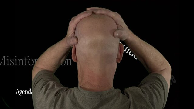 Conceptual clip of a man distressed over fake news