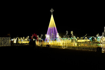 Wide view of Christmas village at night 