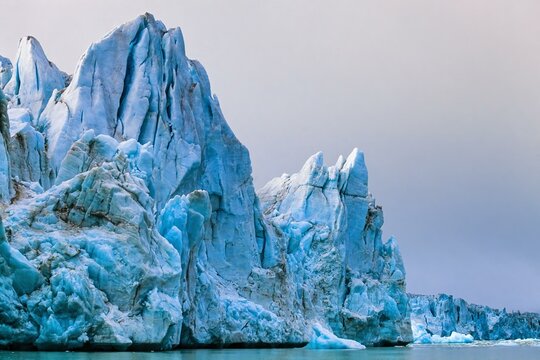 High ice seracs at an glacier at Spitsbergen in the arctic, Svalbard, Norway, Europe
