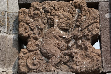 Naked relief on penataran temple wall in Indonesia