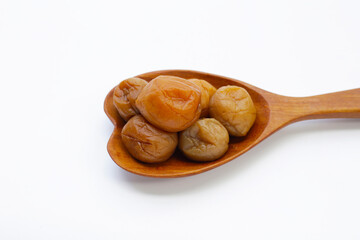 Pickled plums on white background.