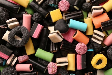 Many different liquorice candies as background, top view
