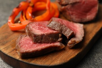 Delicious grilled beef steak on table, closeup