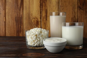 Fresh lactose free products on wooden table, space for text