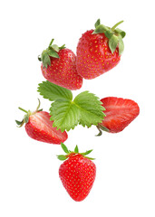 Fresh ripe strawberries and green leaves falling on white background