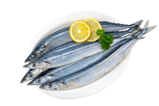 pacific sauries with lemon slice on a dish. 