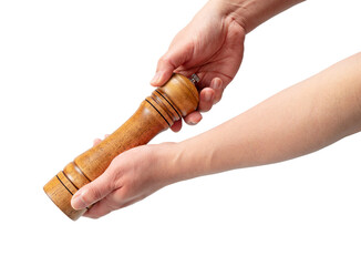 Wooden pepper mill in men's hand isolated on white background. © m________k____