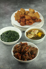 spicy chili chicken liver, and spinach, tempeh and sour vegetables, selective focus