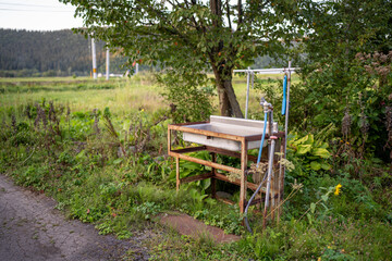 outdoor farm sink in a field in rural central hokkaido japan