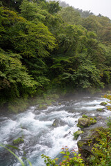 rapids on the daiya river in nikko japan on a misty day