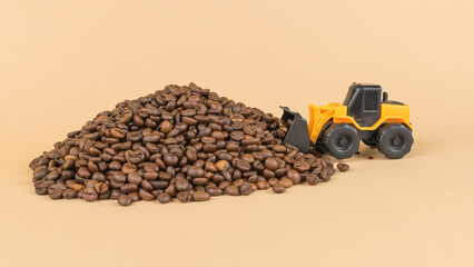 A bulldozer engaged in harvesting coffee. © kvladimirv