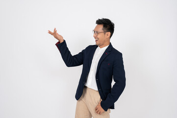 Cheerful Asian businessman in a business suit is opening his left palm and looking on the left side
