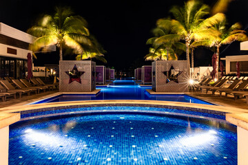 Caribbean luxury resort pool at night