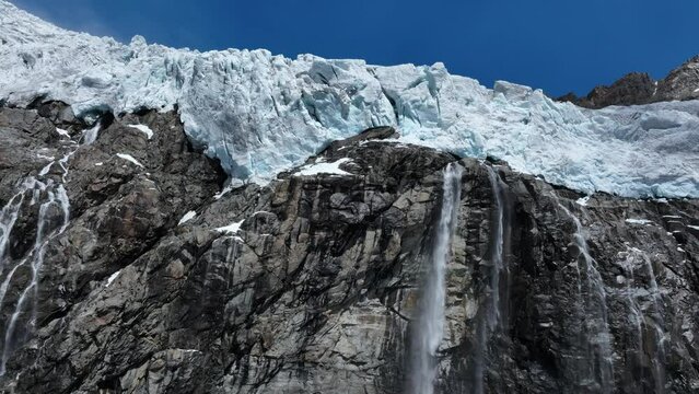 Aerial Upward Drone Closeup Shot of Fellaria's Top part Glacier and its Waterfalls - Valmalenco - Sondrio