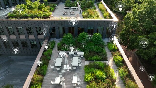 CO2 icon over aerial view of rooftop garden in American city. ESG and carbon footprint reduction theme. Net zero and environment-friendly goals. 3D render animation.