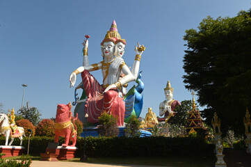 A large outdoor four-faced and four-hands Brahma statue represents the multicultural beliefs of...