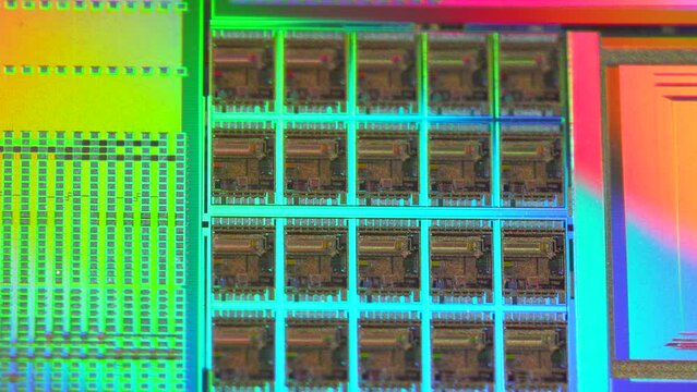 Silicon wafer with microchips after photolithography etching manufacturing used in fabrication of electronic integrated circuits.