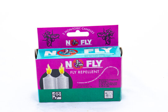 Johannesburg, South Africa - fly repellent candles from No Fly isolated on a clear background with copy space