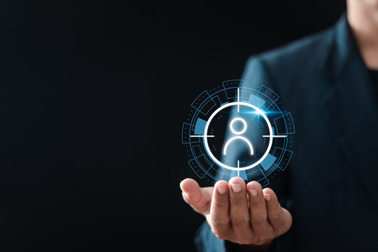 Customer Relationship Management. Businessman holding to target customer icon on vuital screen for customer centric strategies. Target customer, Marketing plan and strategies.