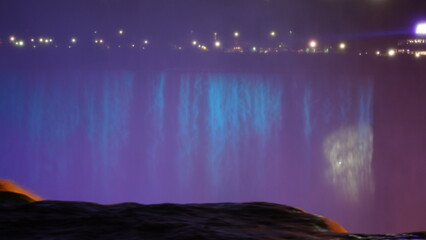 The beautiful Niagara waterfall landscape with the colorful lights on at night