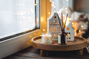 Christmas home aromatherapy. Aroma diffuser with organic essential oil, cinnamon, anise, vanilla...