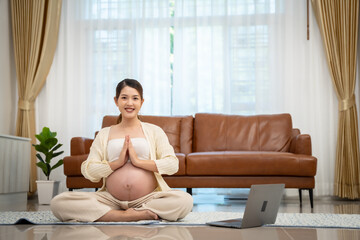 Pregnant woman doing exercise or yoga at home