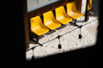 Yellow plastic seats on the road
