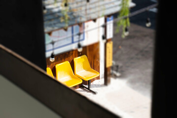 Yellow plastic seats on the road