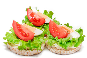 Rice Cake Sandwiches with Tomato, Lettuce and Egg - Isolated on White. Easy Breakfast. Diet Food....