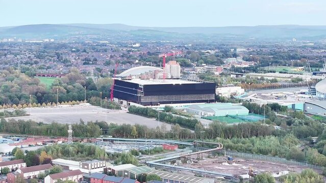 Indoor Arena Co-op Live under construction in Manchester on a sunny day. Zoomed drone shot