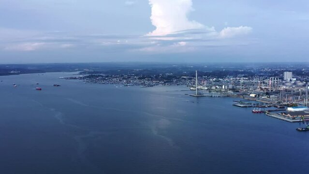 Panorama Of Seaport And Oil Refinery On The Coast Of Borneo In Balikpapan, Indonesia. aerial pan right