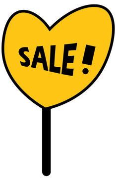 Heart shaped sign that has the word "SALE" written on it