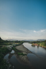 Fototapeta premium River in the middle of the mountains at sunset