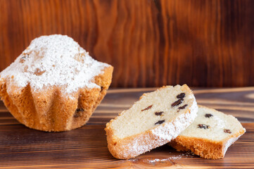 Cupcake with powdered sugar and raisins