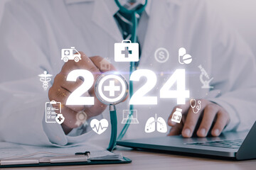 Happy new year 2024 medical and health care concept.Doctor holding stethoscope with 2024 and...