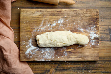 dough on wooden cutting board