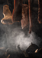 Drying pork meat in smokehouse