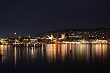 Lake Zurich at night. Old town city light reflected on the water surface, no people