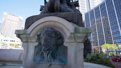 Water trickling from Bison Head Bronze Sculpture at Soldiers and Sailors Monument fountain, Indianapolis, Indiana, USA - Powered by Adobe