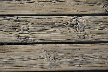 Wood texture. Street boards. The surface of the pier near the water. Deck.