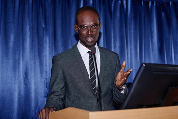 Portrait of African American speaker giving an interview at business conference