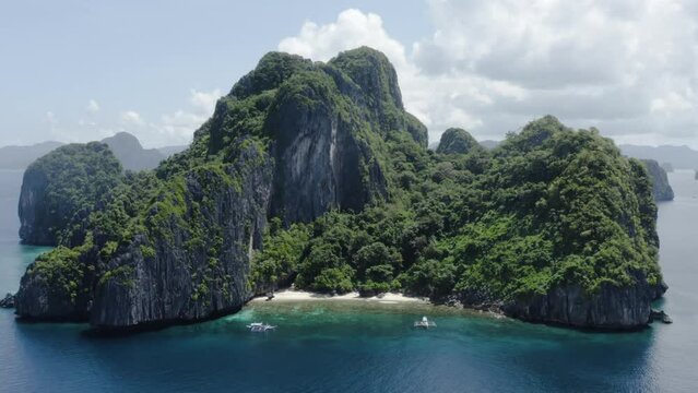 incredible drone shot traveling out of isla bonita in the philippine sea