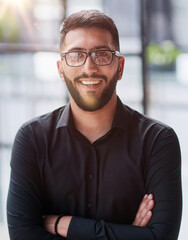 Portrait of smiling young businessman in office