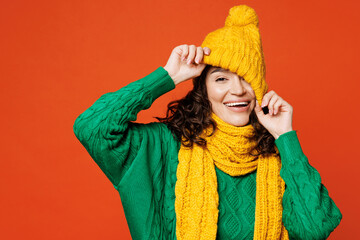 Young cheerful fun cool smiling satisfied happy woman she wear green knitted sweater yellow scarf...