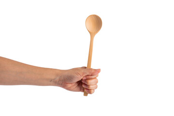 Wooden spoon in hand on transparent background.