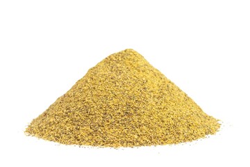 Pile of mustard organic fertilizer on white isolated background