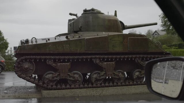 Normandy, France. 11-01-2023. Tank on display seen from the window of a car. Memorial Museum of Omaha Beach. Slow motion 4K