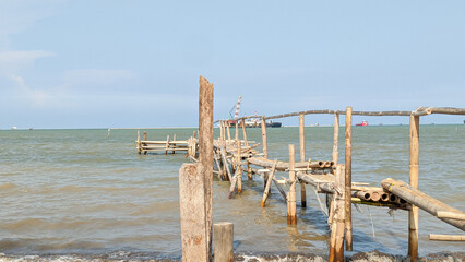 Fototapeta na wymiar Wooden bridge in the sea, Indonesia, sea, blue sky
