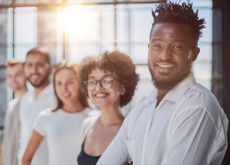 Portrait of smiling African American business man with executives working in background